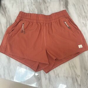 Vuori Women's Athletic Shorts in Rust